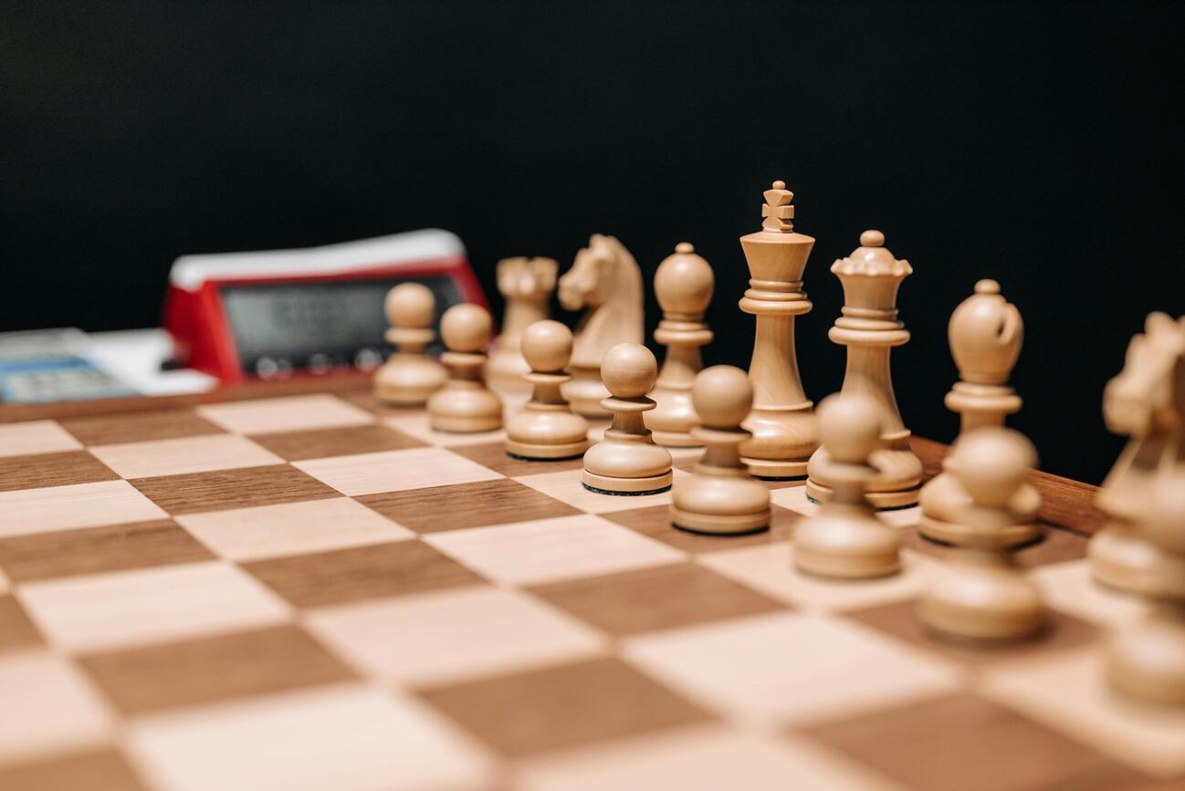 Chess board strategic thinking artificial intelligence problem solving DeepMind Demis Hassabis approach