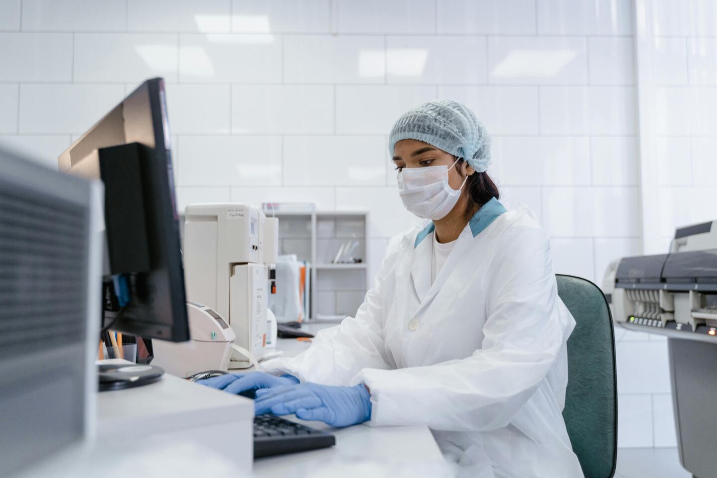 Interdisciplinary research team scientists collaborating AI laboratory drug discovery innovation